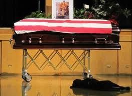 My Hero is gone…Navy SEAL Jon Tumilson lay in a coffin, draped in an American