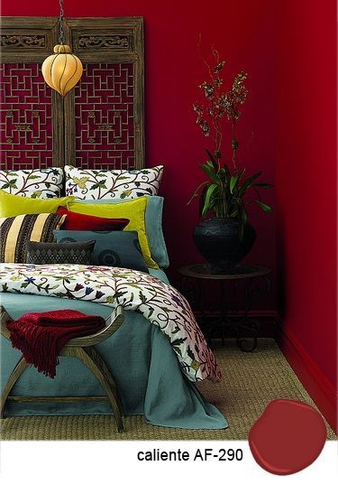 Benjamin Moore Caliente AF-290 on this bedrooms ruby red wall. Nice accent color