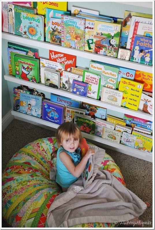 DIY Linear Bookshelves.  Smartest part of her room!
