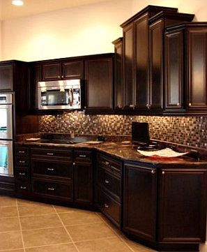 love the dark cabinets and the lights above and below them!