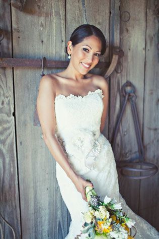 This bride is beautiful in a gown and belt both by Enzoani. // Photo courtesy of