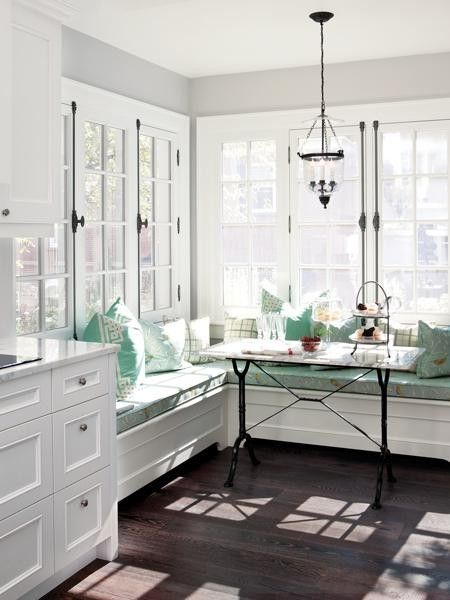 The soft green and dark floor look amazing with the white woodwork — or is it t