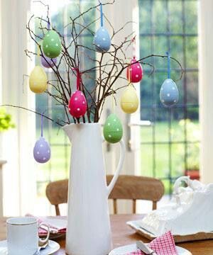 Hang Easter eggs from dried branches for a cute Easter centerpiece.