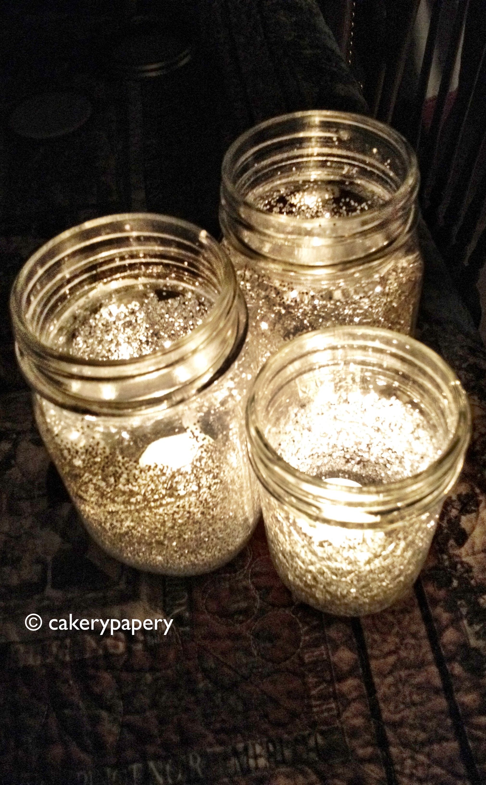 Mix water with Elmers glue and brush the inside of the mason jars. Add glitter o