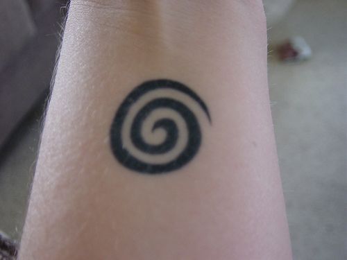 Spiral Tattoo-Represents ethereal energy radiating out (or inward depending on y