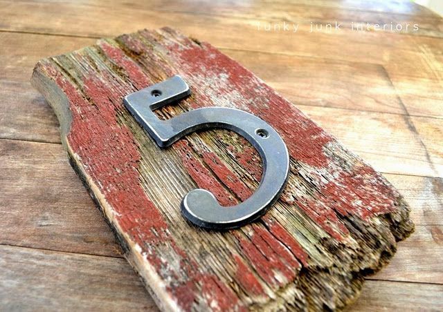 Take old fence posts or other weathered wood and create individual numbers for y