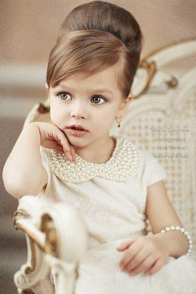 This petite mademoiselle is pretty in pearls and ready for flower girl duty.