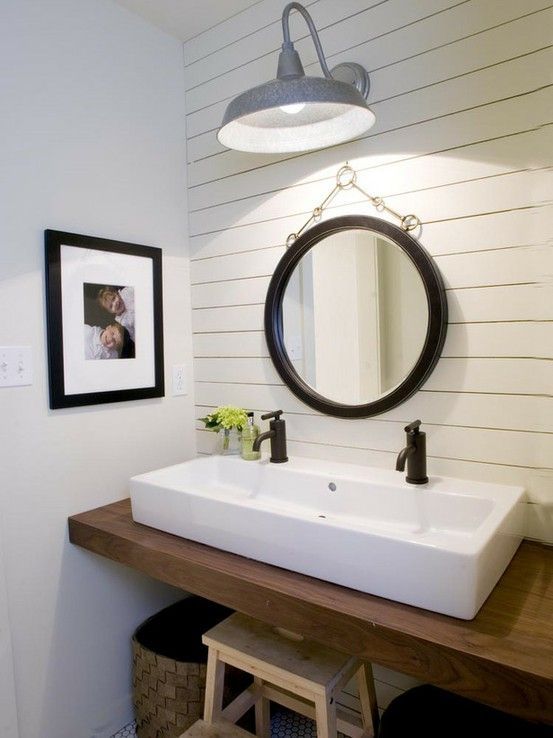 Coastal powder room design with paneled accent wall, chunky wood floating bathro