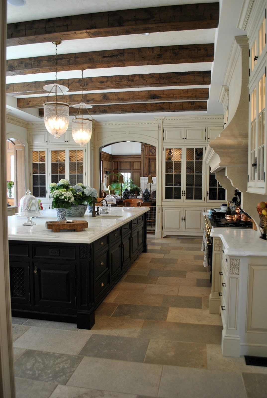 beautiful kitchen, full of character. love the dark beams, limestone floor, huge