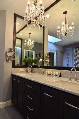 Master bathroom. I love the marble counters, the chandelier light and the dark f