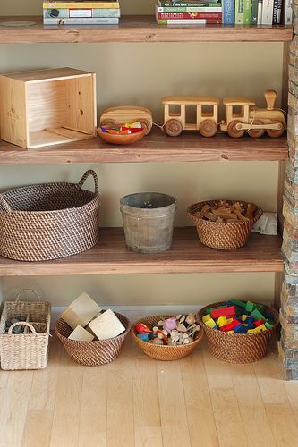 toy storage.  Shelfs and little bins/baskets.  Im afraid with shelves, though I