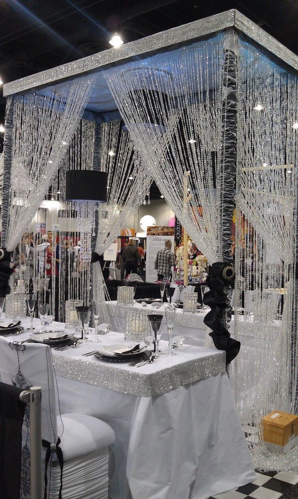 crystal strands ~~ over black and white themed table –  Now this makes me go WOW!!! This is just beautiful. I would switch the black colors to match the season or