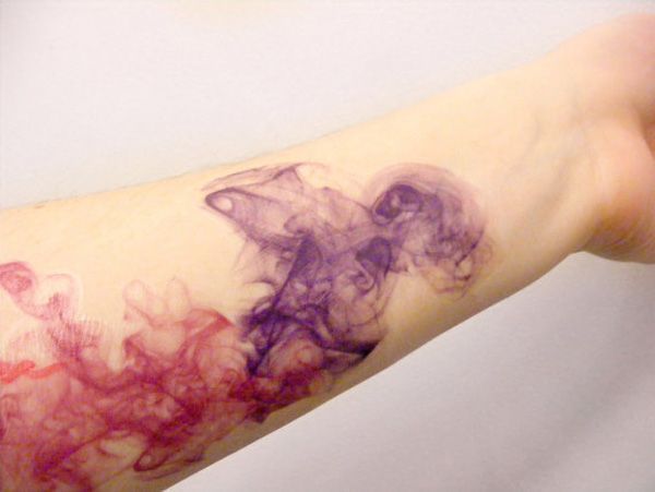 This is the kind of abstract watercolor tattoo that I love! Looks like ink in water.I like this too.
