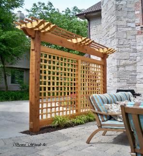 A combination pergola/trellis provides privacy for this outdoor dining area.  – Bower Woods llc. Custom Garden Structures, Trellis