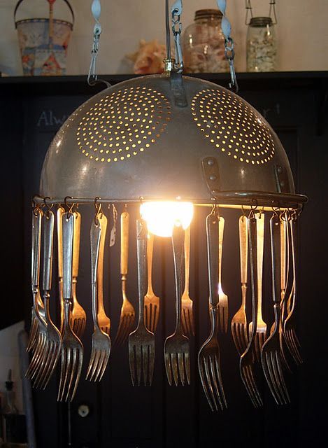 AN old colander hung with old silverware as the substitute for crystals,  the light kits are sold in craft stores, hardware stores