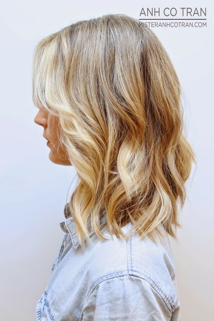 the perfect “in-between” cut made better by skipping the “awkward stage flip” choosing beachy curls over a super smooth style.
