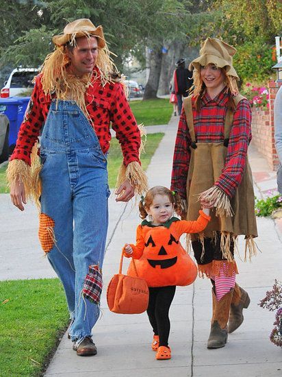 : Alyson Hannigan and her husband, Alexis Denisof, got into the spirit as scarecrows with their daughter as a pumpkin in LA in