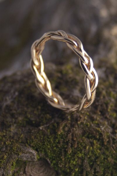 Gold braided ring!! Beautiful would go perfect with a solitaire diamond ring…this would be cute.