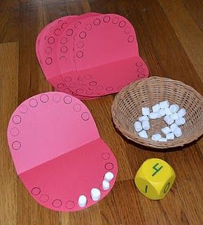 Great for tots – preschoolers to begin to learn about numbers and teeth! =)  I would have older kids roll twice and put the number
