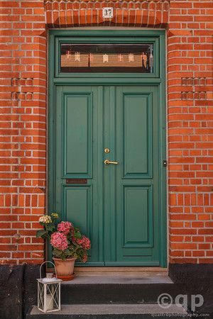 Green door and brick