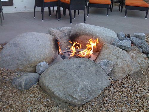 Natural Rock Fire pit…utilize boulders, large stones and sand or fire bricks to create an organic shaped pit. These types of