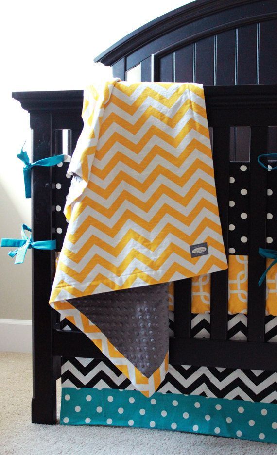 Adorable nursery for a boy or girl! Featured Premier Fabrics: Zig Zag Corn Yellow (blanket), Polka Dot Black (bumper), Gotcha Corn