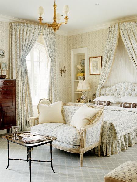 Feminine bedroom with antiques, small-print floral fabric, draperies and corona – Cathy Kincaid