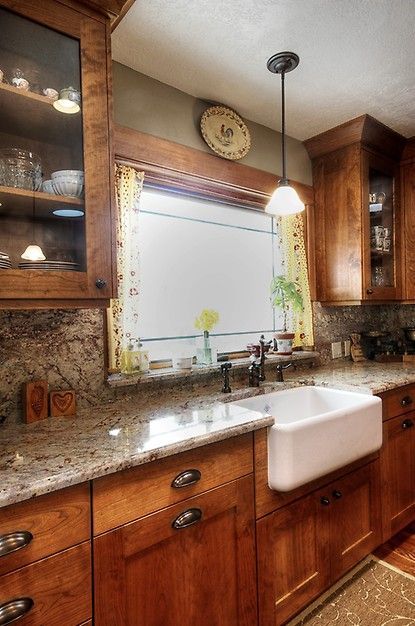 Glass cabinets, farm house sink, cabinet color, window over sink, everythings perfect