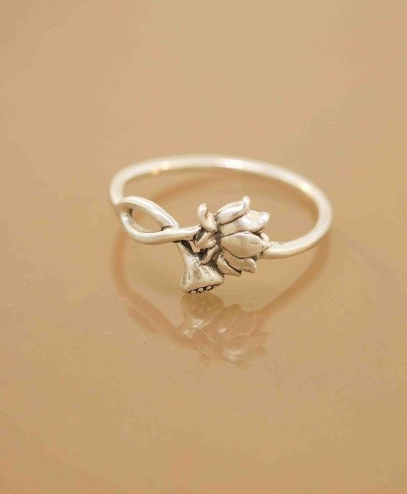lotus blossom ring .. one in stock. i emailed the seller to see what size. cross your fingers for me!