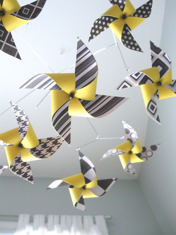 LOVE LOVE LOVE the idea of a pinwheel mobile!  bright colors can face the baby AND it can be DIY!!