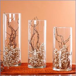 Love the beeding and branches- would make a great center piece! (I would prefer the branches to be spray painted black though)