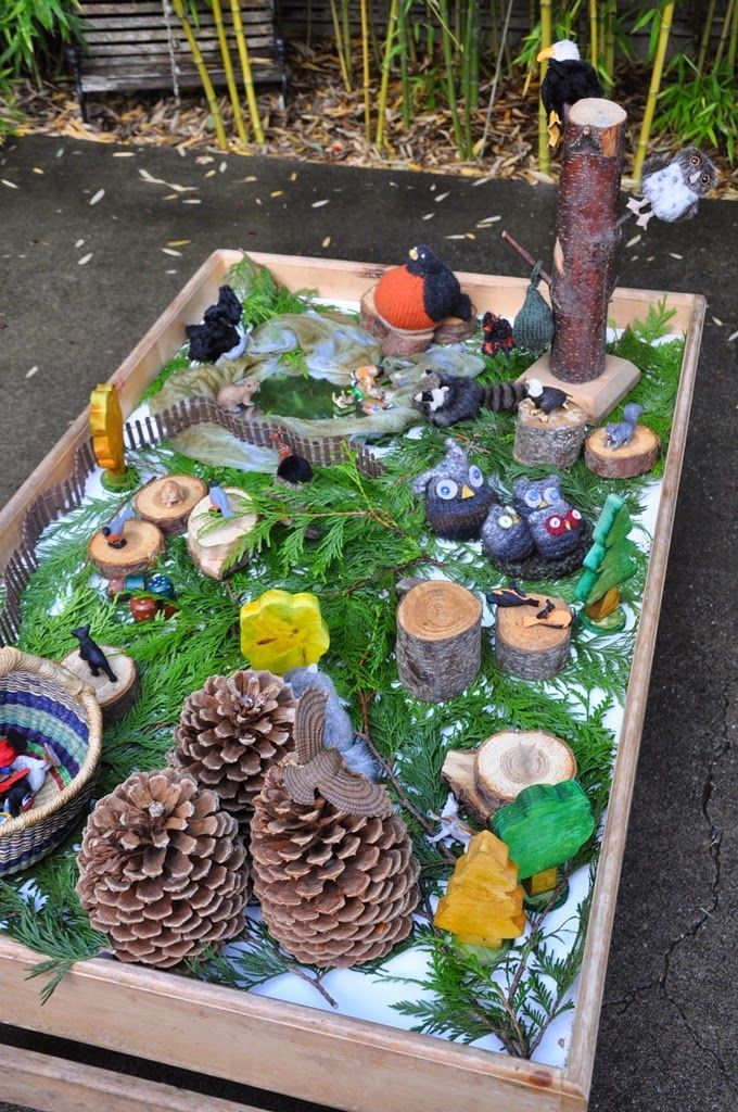 Outdoor exploration table. There are a lot of wonderful pictures and open-ended play ideas here!