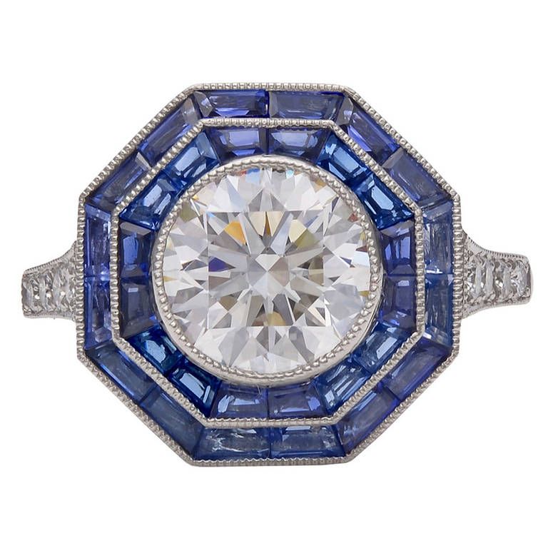 Tiffany & Co. Sapphire Diamond Platinum Octagonal Ring. onal ring with milgrain. bead set at center with one brilliant cut diamond