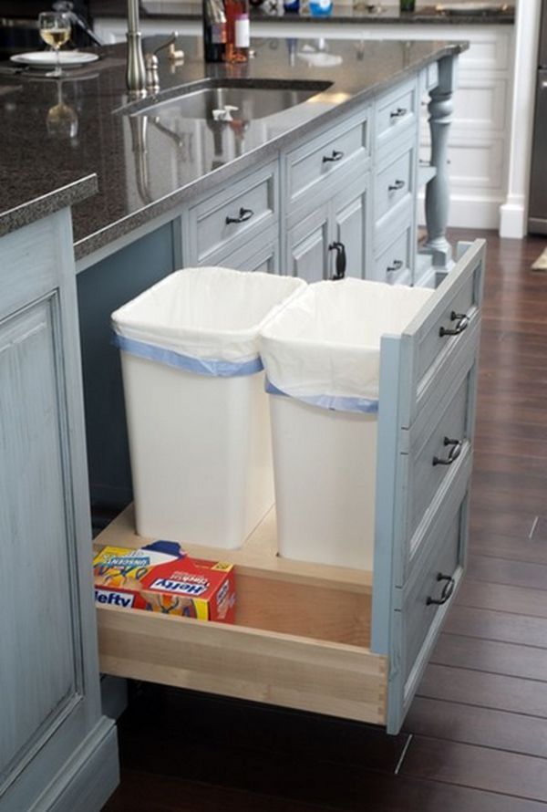 20 Best DIY Kitchen Upgrades: 7. Transform a regular cupboard into a pull-out drawer for hidden trash and recycle receptacles for