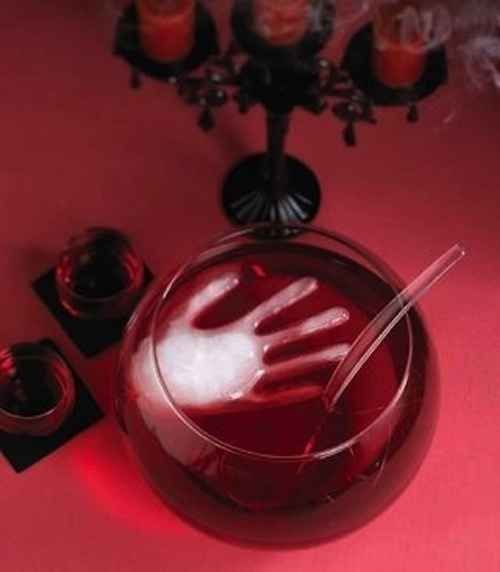 A rubber glove makes for some truly creepy ice. | 27 Incredibly Easy Ways To Upgrade Any Halloween Party