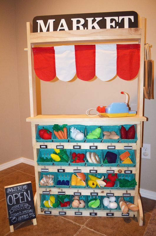 Amazing DIY play market for less than $100! Link to building plans. Interchangeable play stand for grocery store, bakery, ice