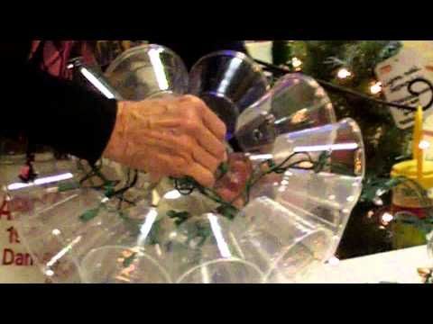 DIY- how to make a holiday light sparkle ball from clear plastic cups and a light set.   This version uses a drill and staples,