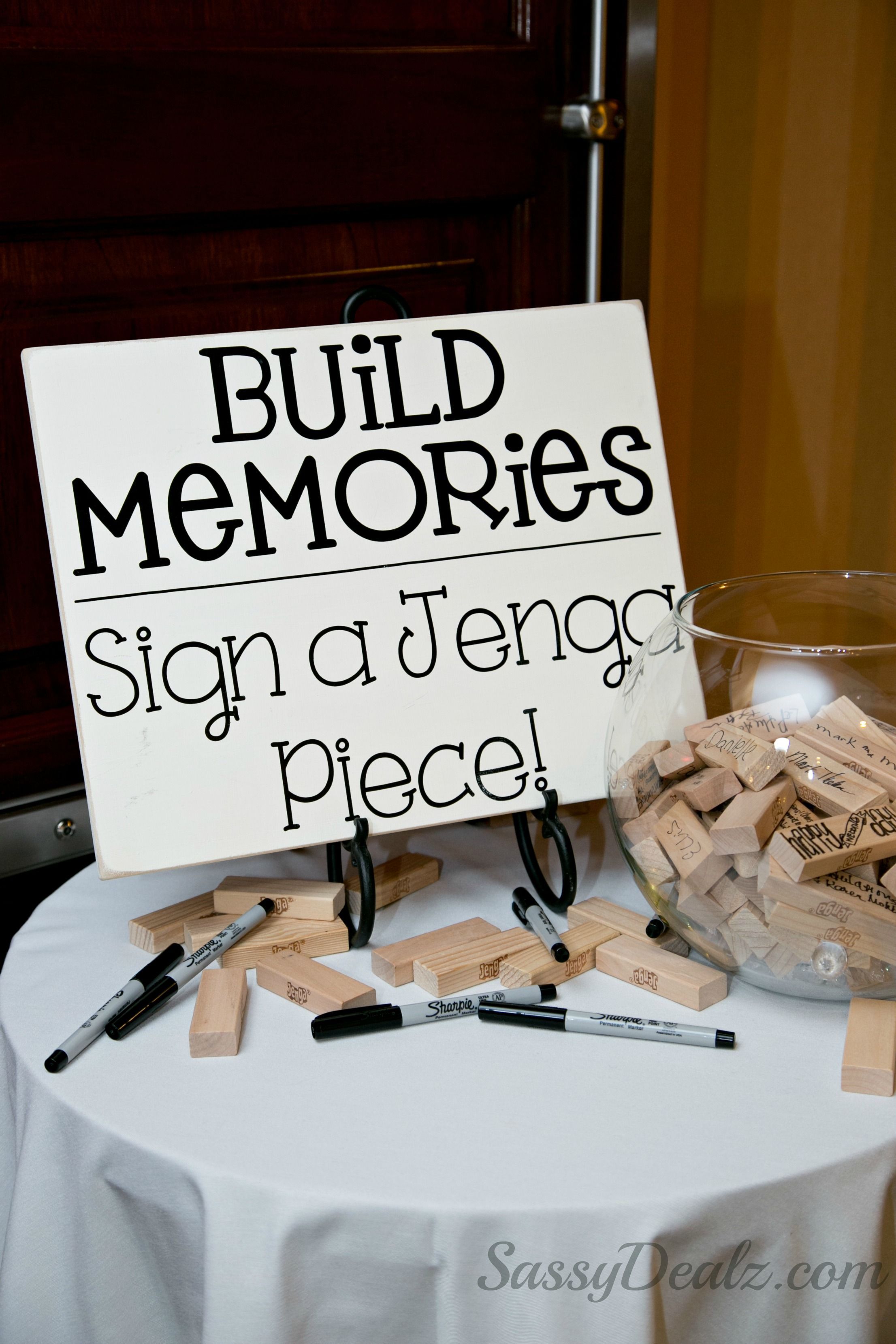 DIY Jenga guestbook wedding idea! The sign “Build memories sign a jenga piece” was made from a wood board with decal letters. Just