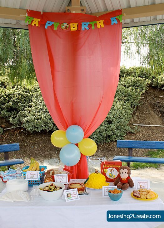 Dollar Tree tablecloth hung up to hide the poles… park birthday party.  I would use pink or purple though to match the theme