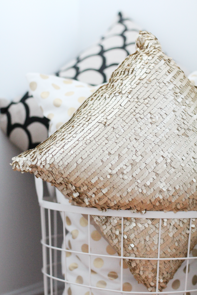 Extra girly pillows thrown into a large wire basket. STEPHANIE STERJOVSKI : KEEPING COZY