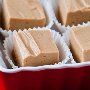 Foolproof Peanut Butter Fudge with 2 ingredients! Take a 16oz (1LB) tub of vanilla cake frosting, microwave for 1 minute. Mix in