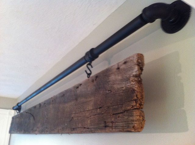 galvanized pipe and old barn wood — with your last name or a quote written on the wood