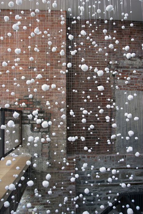 Goran Tomcic   “White Pom-poms”  2005  Installation (fishing line, white pom-poms)