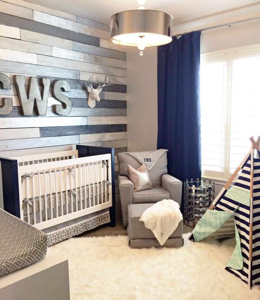Gray and Navy Nursery with Metallic Wood Wall – we love this take on a wood accent wall. So chic!