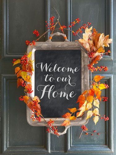 Greet guests with this charming alternative to a fall wreath. Simply apply a layer of chalkboard paint to the inside of an old