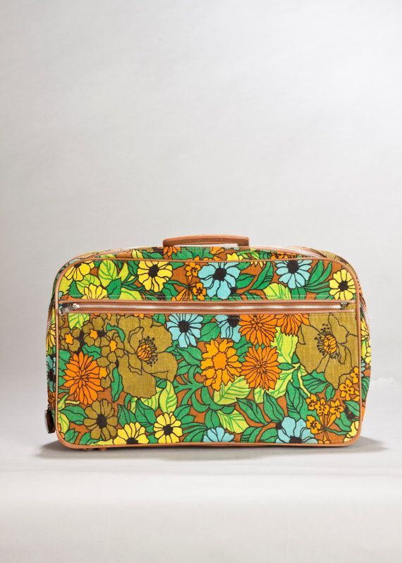 Heres another 1960s flower suitcase showing the zipper. It even came with a tiny key for the lock.