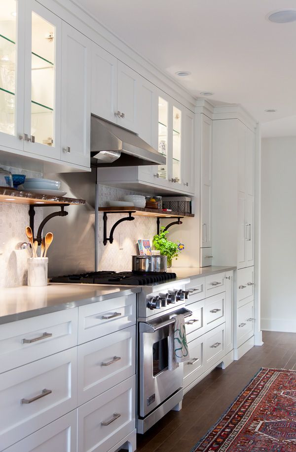 Kitchen makeover: White cabinets, wood floors and gray countertops