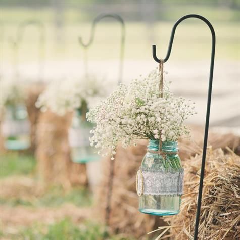 Love this idea for an outdoor country wedding And then use the as centre pieces at reception. Add coral and bow and more flowers