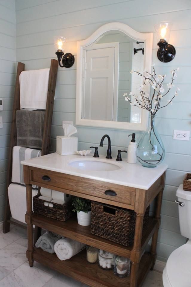 nice style mirror and lighting for above sink, use larger wood piece as medicine cabinet/storage above toilet