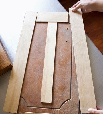 remember this as all the kitchens weve seen lately are incredibly outdated.    Re-face cabinet doors with thin strips of plywood